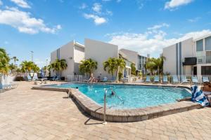 a swimming pool in the middle of a resort at #231 F Madeira Beach Yacht Club in St. Pete Beach