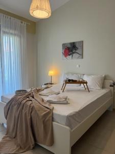 Posteľ alebo postele v izbe v ubytovaní Polychrono Apartments