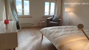 Una cama o camas en una habitación de flueli holiday home urnaesch