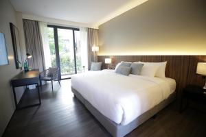 The Maximilian Hotel客房内的一张或多张床位