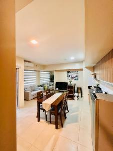 a kitchen and living room with a table and chairs at * * *H Incomparable Value in Iloilo City