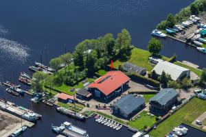 an aerial view of a marina with boats in the water at Villa-am Wasser- Wellness-NationaalPark- in Earnewâld