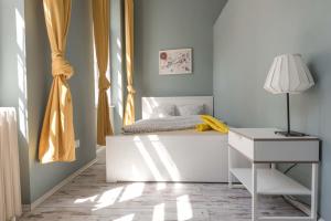 Postel nebo postele na pokoji v ubytování Dohany Design Apartments