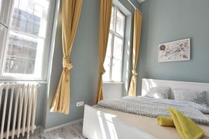 Postel nebo postele na pokoji v ubytování Dohany Design Apartments