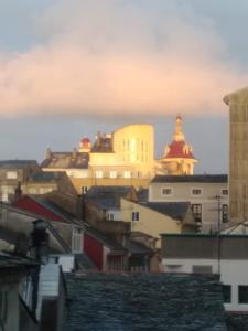 a view of a city with a church in the background at Ribadeo Centro in Ribadeo