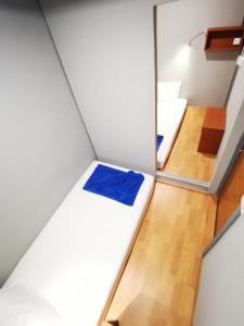 Postel nebo postele na pokoji v ubytování Leisure Hostel