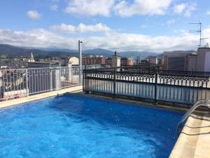 a swimming pool on the roof of a building at Ribadeo Centro in Ribadeo