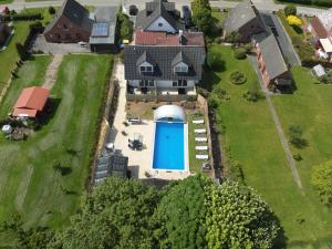 an aerial view of a house with a silo at Familie Decker-Behrends in Upleward