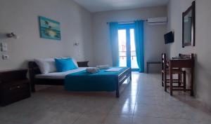 Postel nebo postele na pokoji v ubytování Hotel Mochlos