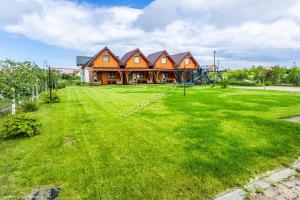 Κήπος έξω από το Domki letniskowe Oaza 2