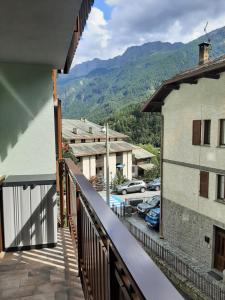 a balcony with a view of a parking lot at CIVICO 43 in Chiesa in Valmalenco