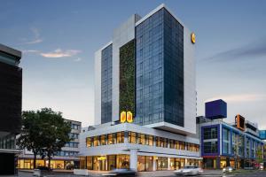 a tall building with a sign on top of it at Super 8 by Wyndham Koblenz in Koblenz