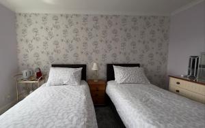Postel nebo postele na pokoji v ubytování Dunrigh Guest House