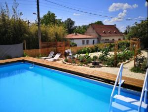 a swimming pool in the backyard of a house at R & R BERGERAC in Bergerac