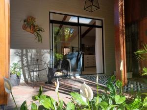 a screened in porch with a glass door at Eggersheim in Pinetown