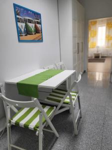 a table and a chair in a room at Budget studio near Prater in Vienna