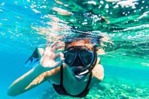 a person in the water with a snorkel at Casa da Rosa in Arcozelo