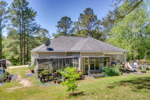 a house with a garden in the yard at Georgia Vacation Rental 14 Mi to Downtown Augusta in Hephzibah