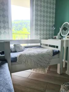 Posteľ alebo postele v izbe v ubytovaní Apartament Sun House SAUNA KOMINEK SKRZYCZNE