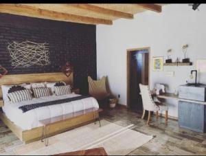 Postel nebo postele na pokoji v ubytování Tierra Madre Hotel Boutique