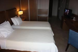 Posteľ alebo postele v izbe v ubytovaní Hotel Cariatis