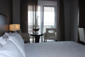 Posteľ alebo postele v izbe v ubytovaní Hotel Cariatis