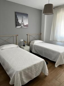 Posteľ alebo postele v izbe v ubytovaní Apartamento Arenas + 2 fotografie