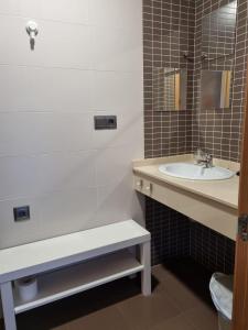 a bathroom with a sink and a bath tub and a sink at Casa As Neves - 1B Gran Ventanal in Malpica