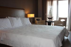 Posteľ alebo postele v izbe v ubytovaní Hotel Cariatis
