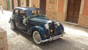 an old blue car is parked on a street at Casas Mancha in Torrenueva