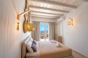 Postel nebo postele na pokoji v ubytování Manolia View Mykonos + 37 fotografií