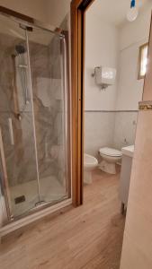 a bathroom with a shower and a toilet at BILO EGADI E MONO EGADI in Favignana
