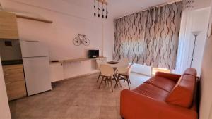 a living room with a couch and a table at BILO EGADI E MONO EGADI in Favignana