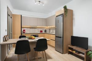 A kitchen or kitchenette at ModernPastel Apartment - Private Parking,Near the Old Port