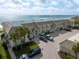 an aerial view of a row of houses with the ocean at El Mar Villa in Ponte Vedra Beach