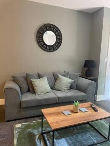 a living room with a couch and a table at Poplar House-2Bedroom house in town centre with free Parking by ShortStays4U in King's Lynn