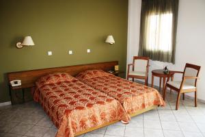 Posteľ alebo postele v izbe v ubytovaní Hotel Cariatis