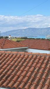 a view of the roofs of two buildings at Tasos_Studios&Apartments 2 in Kranidi
