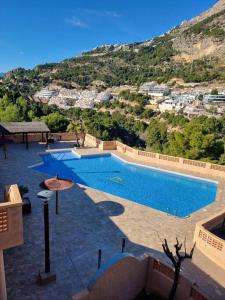 Bazén v ubytovaní Pueblo Mascarat, 50 m al mar, 3 piscinas alebo v jeho blízkosti