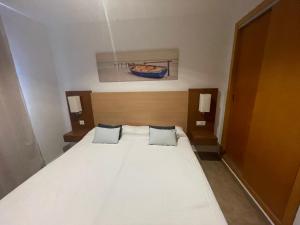 Postel nebo postele na pokoji v ubytování Punta Umbria ideal apartamento Enebrales + 12 fotografií