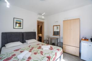 a bedroom with a bed with towels on it at Liana Studios in Mikonos