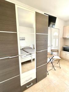 a room with a closet with a bed in it at RIZES ELIAS PRIVATE STUDIO in Isterni