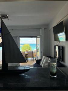 a living room with a view of the ocean at Ελένη in Megalochori
