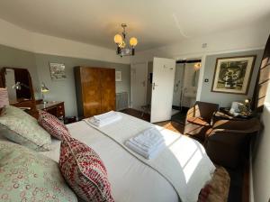 a bedroom with a bed and a living room at Milvil in Gosport