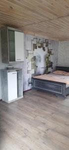 a bedroom with a large bed in a room at Forest Life in Kovel