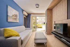a living room with a couch and a fireplace at Supreme Studio Apartment Bijoux in Umag