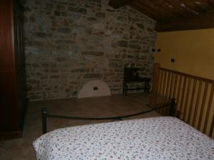 Postel nebo postele na pokoji v ubytování Agriturismo il Tiglio