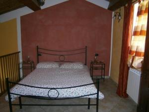 Postel nebo postele na pokoji v ubytování Agriturismo il Tiglio