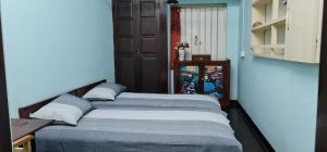 Postel nebo postele na pokoji v ubytování CHARAKAMA Guest Bungalow - GAMPAHA