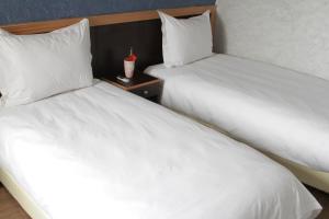 Łóżko lub łóżka w pokoju w obiekcie Hôtel Belle Vue et Spa